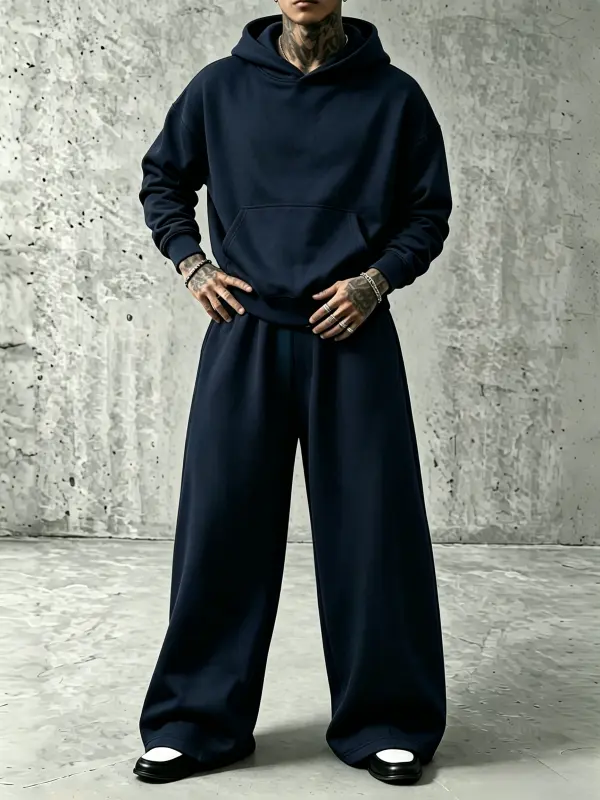 قطعتان طقم رياضي للرجال: هودي وبنطلون رياضي واسع الساق، لون موحد، مريح للارتداء اليومي وأسلوب الشارع